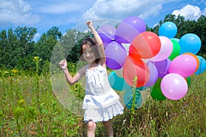 Girl running with balloons