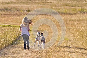 Girl running with dogs