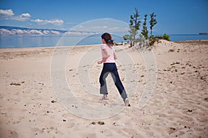 Girl Running in Olkhon Island Sand