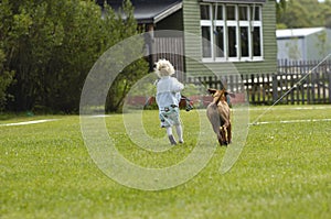 Girl running with puppy