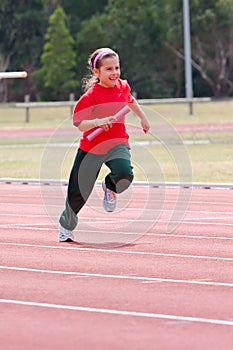 Girl running in sports race