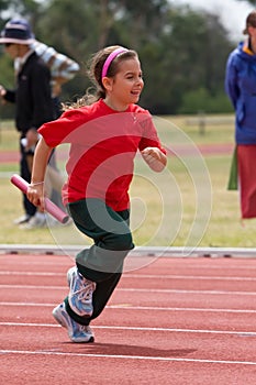 Girl running in sports race