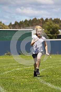 Girl running in sports race