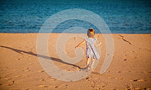 Girl running to the sea