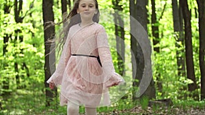 Girl runs along a forest road