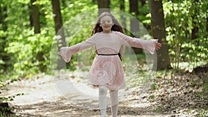 Girl runs along a forest road