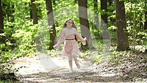 Girl runs along a forest road