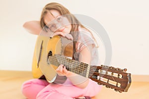 Girl with russian seven-string acoustic guitar