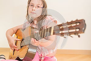 Girl with russian seven-string acoustic guitar