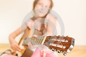 Girl with russian seven-string acoustic guitar