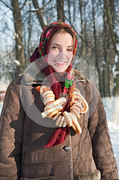 Girl in russian traditional clothes with cracknel photo