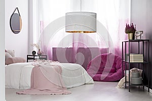 Girl`s bedroom with pink pouf photo