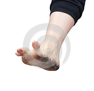 Girl& x27;s dirty foot isolated on white background