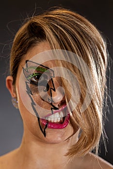 Girl's Face in Lightning Makeup Covered By Hair Lip Snarl photo