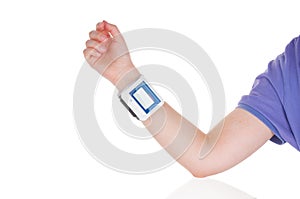 Girl`s hand with compact tonometer on white background