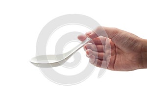 girl's hand holding an empty spoon