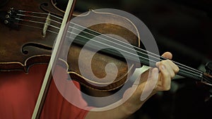 Girl`s hand on the strings of a violin. Girl`s hand on the fingerboard violin.