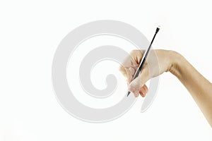 Girl`s hand writes in empty space isolated on background