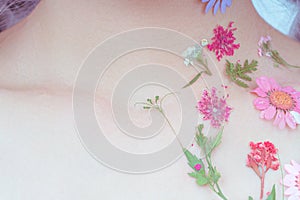 A girl`s neck with flowers