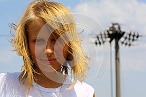 Girl's portrait on sky background