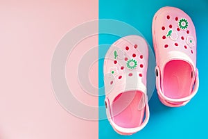 Girl`s rubber sandals isolated on the bright background.Kids beach shoes. Colorful footwear. aqua shoe for tropical