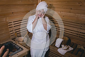 Girl`s in the Sauna room , Refreshing in tropical wood room. To