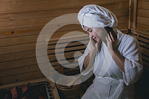 Girl`s in the Sauna room , Refreshing in tropical wood room. To keep the body healthy