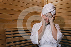 Girl`s in the Sauna room , Refreshing in tropical wood room. To keep the body healthy