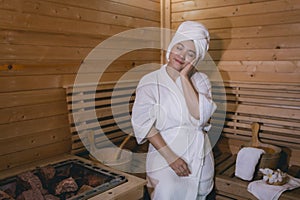Girl`s in the Sauna room , Refreshing in tropical wood room. To keep the body healthy