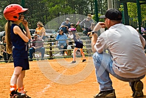 Girl's Softball Runner and Coach