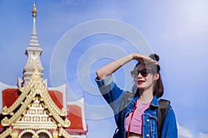 A girl`s traveler with a look and see the map. In the Thai templ