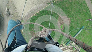 Girl in safety equipment in rope park