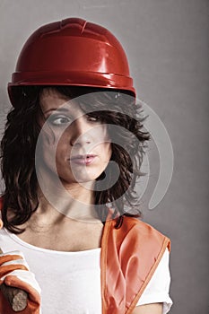 girl in safety helmet and orange vest