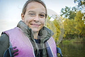 A girl is sailing in a boat in the park