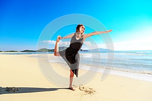 Girl, sand, balance posture in yoga, arm extended in front