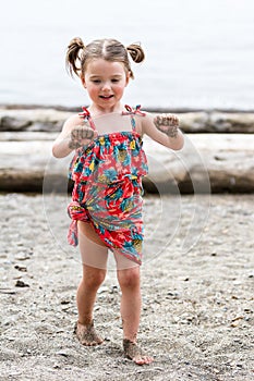 Girl with sand on her hands photo