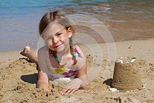 Girl with sandcastle