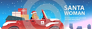 Girl in santa claus costume delivering gifts on red car merry christmas happy new year holiday celebration concept