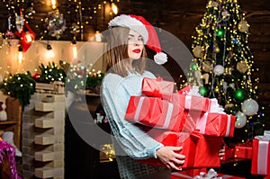 Girl in santa claus hat. Christmas shopping. Happy new year. Family celebration. Christmas tree. Winter holiday. Sexy