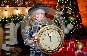 Girl santa claus hat and clock. Meet Christmas holiday. Festive atmosphere christmas day. New year countdown. Counting