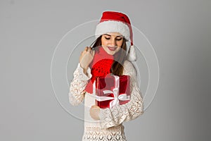 Girl in santa hat with gift