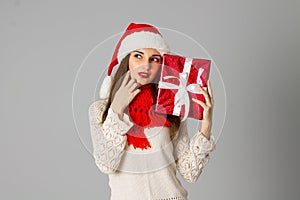 Girl in santa hat with gift