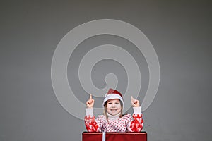 Girl in Santa hat having an idea. photo