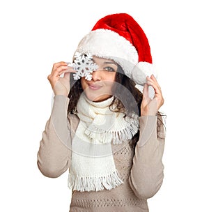 Girl in santa hat portrait with snowflake posing on white background, christmas holiday concept, happy and emotions