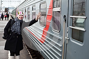 Girl says goodbye on rail platform