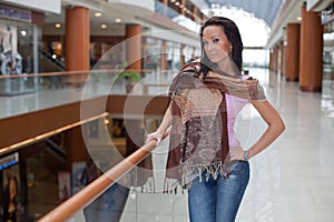 Girl with a scarf over mall background