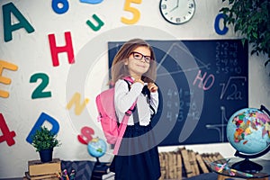 Girl with a school backpack. The concept of school, study, education, friendship, childhood.