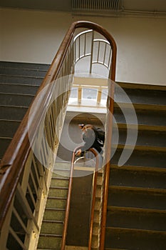 Girl in school staircase