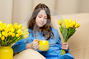 Girl schoolgirl with a mug in her hands.