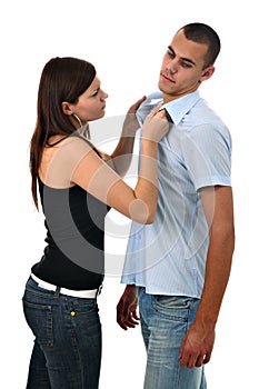 Girl scolding boy grabbing his collar isolated